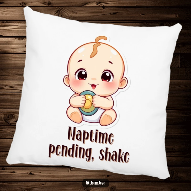 Funny chubby baby with wide, curious eyes holding a rattle, printed on a soft, decorative pillow.