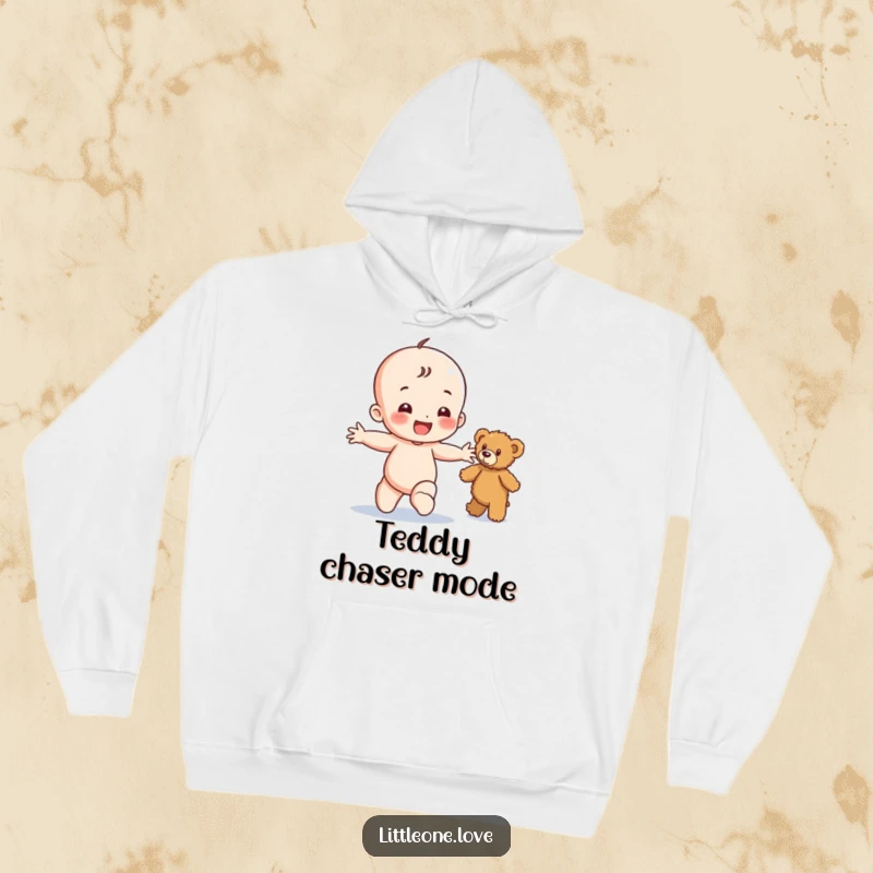 Funny hoodie featuring a happy baby character toddling enthusiastically towards a fuzzy teddy bear, promoting warmth and cheer.