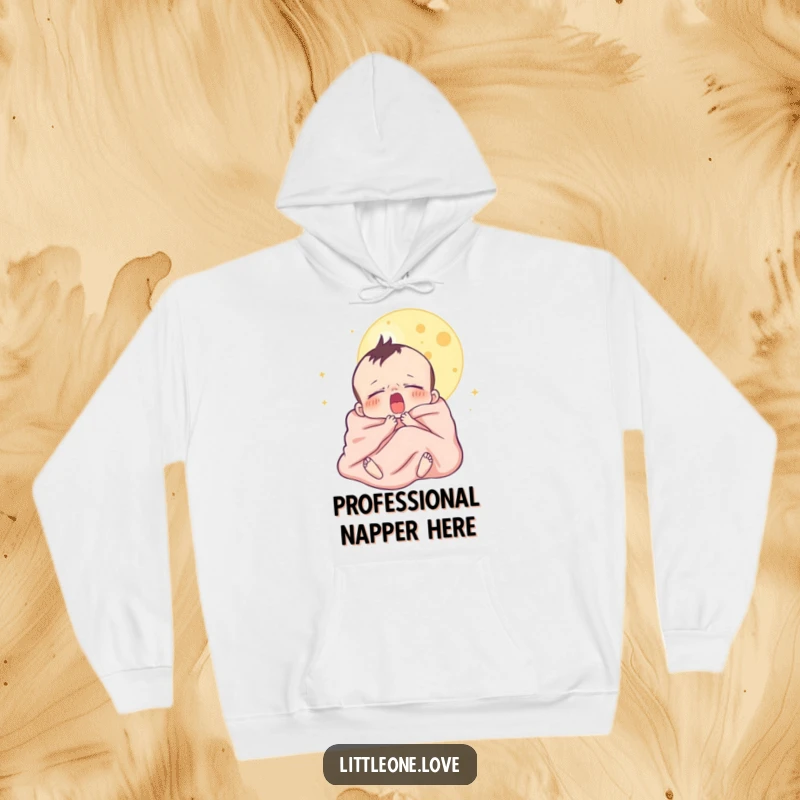 Funny hoodie featuring a sleepy baby character yawning beneath a moon, all cozy in a blanket, ideal for warmth and amusement.