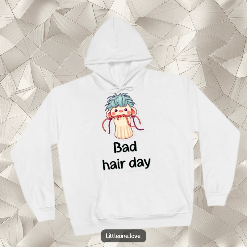 Funny hoodie depicting a small, handmade sock puppet with yarn hair, its mouth humorously obstructed by loose strands of colorful yarn.