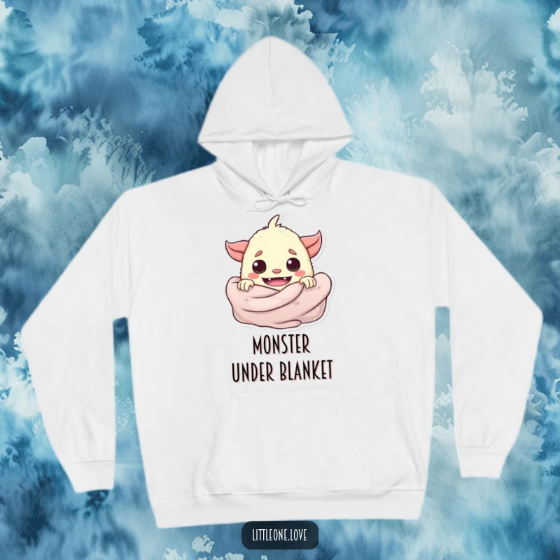 Funny playful baby monster peeking from behind a soft blanket, featured on a warm, plush hoodie.