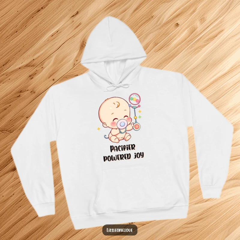 Funny Hoodie: A baby character wearing a pacifier lets out a happy giggle while reaching towards a vibrantly colored mobile.