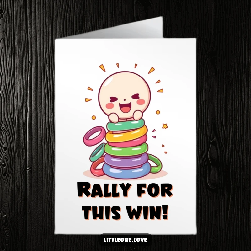Funny Free Printable Congratulations Card: Gleeful sentient rattle smashing a tower of colorful rings, celebrating a big win.