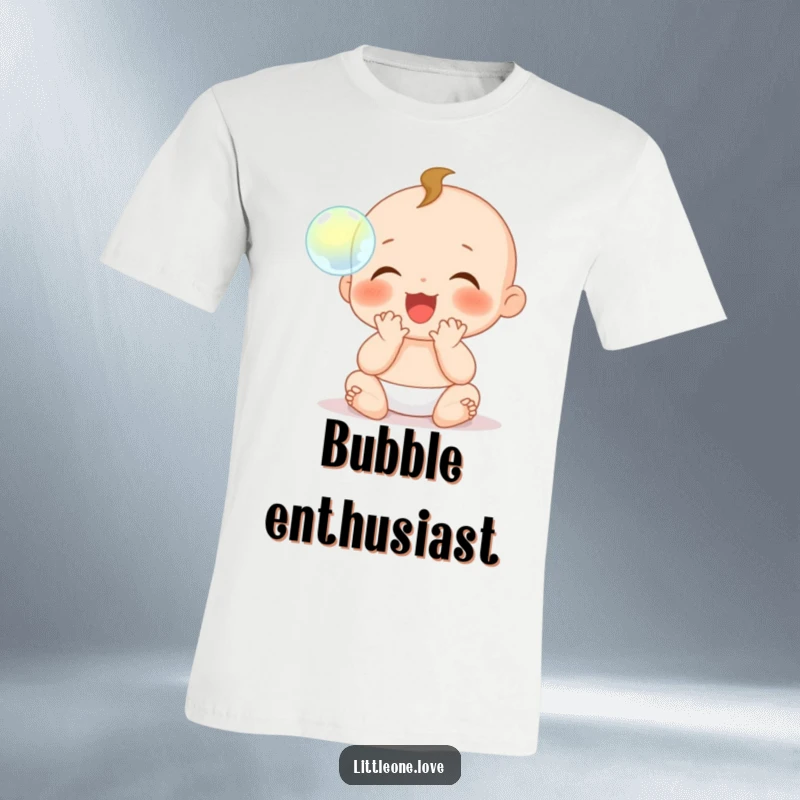 Funny T-Shirt: A baby character with tiny hands is shown clapping gleefully, captivated by a floating, shimmering bubble.